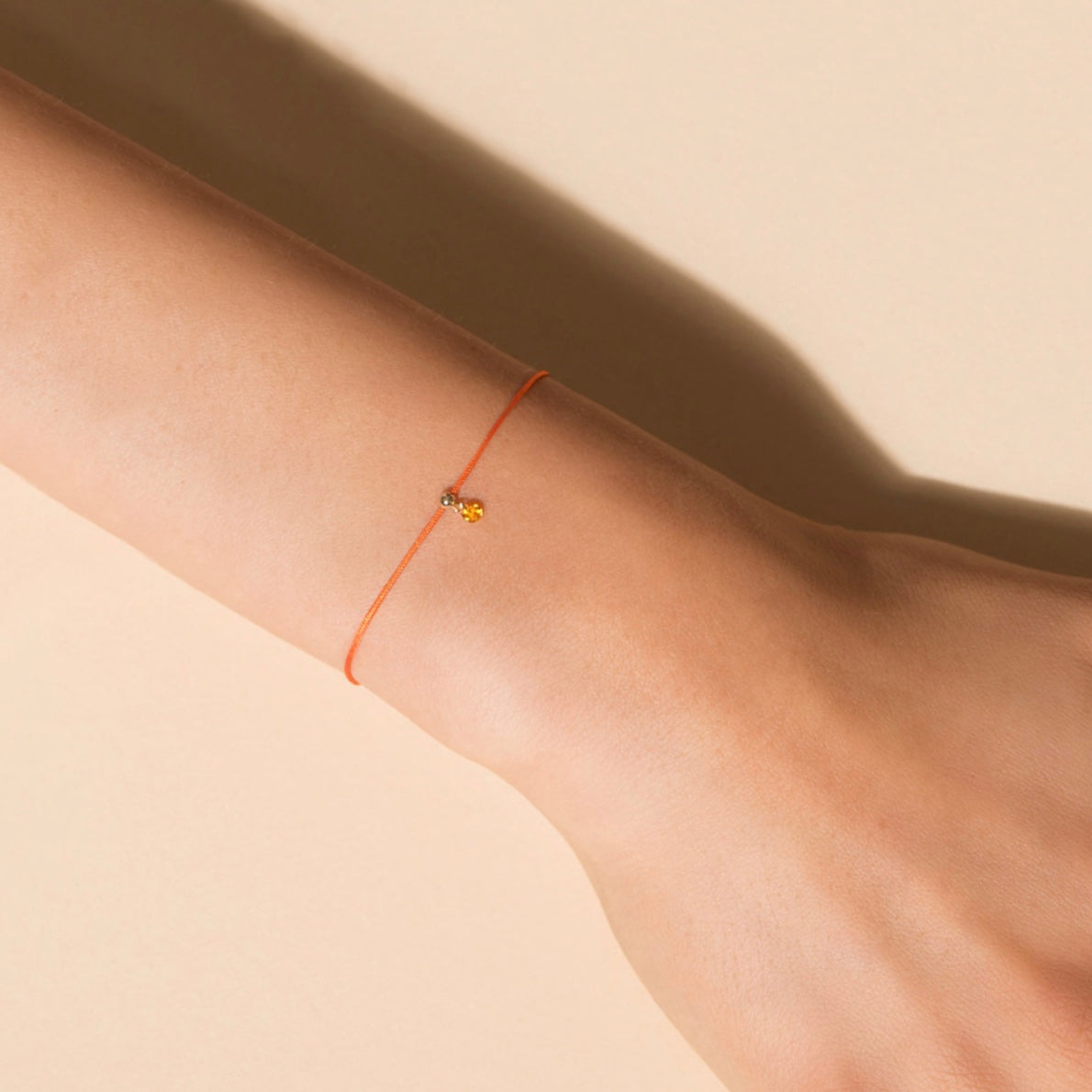 Floating Orange Sapphire Cord Bracelet