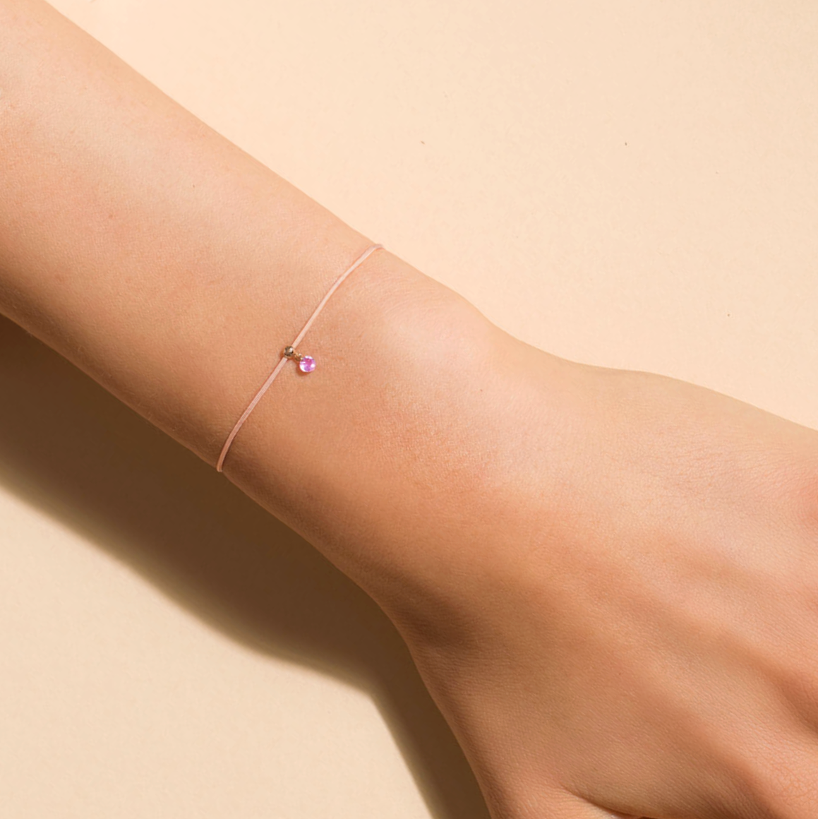 Floating Pink Sapphire Cord Bracelet